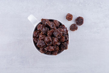 Dried sour black cherries in a cup