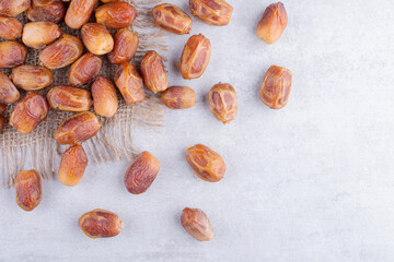 Yellow dates isolated on concrete background