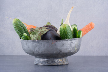 Vegetable set in an ethnic metallic cup