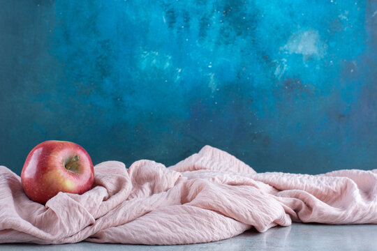 Red Apples Isolated On A Pink Tablecloth