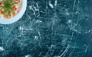 Turkish menemen salad with herbs in a white plate