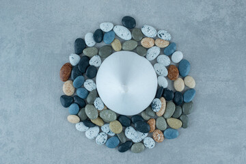Multicolor decorative beach stones on grey background