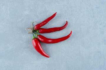 Red hot chili peppers on blue background