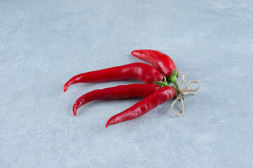 Red hot chili peppers on blue background