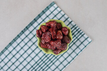 Dried indian jujube berries in a ceramic cup