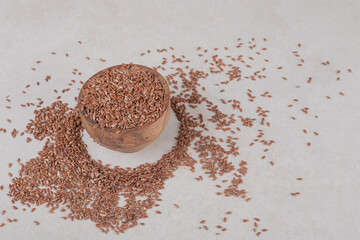 Brown wheat grains isolated on concrete background
