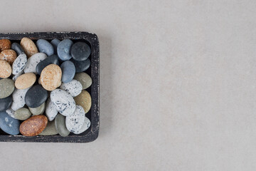 Beach stones for decoration on concrete background