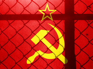 Backlight Backlight with physical Soviet flag and barbed wire. Prison concept with border image....