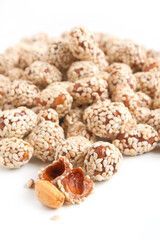 Roasted peanuts in sugar syrup with sesame seeds