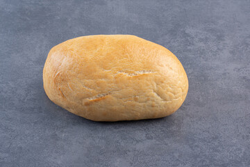 Two buns displayed on marble background