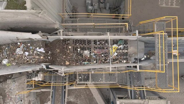 Waste Moving Through a Recycling Plant Belt