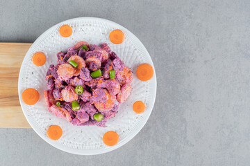 Purple salad with carrots, green chili and beetroots