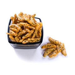 puffed rice with wasabi in black glass bowl close up on white background