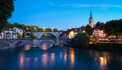 Fototapeta na wymiar Image of bridges on the Aare River in Bern, capital city of Switzerland, during twilight blue hour.
