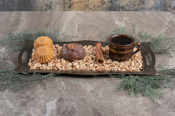 Snack platter with baked goods on marble background