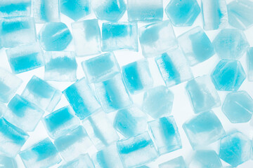 Blue ice cubes isolated white background. freshness. freezing. frozen pieces of ice close up