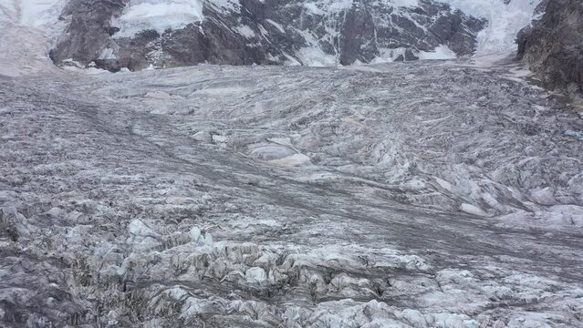 Flying Over the Big Mountain Glacier. Aerial View