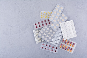 Assorted packs of medical drugs on marble background