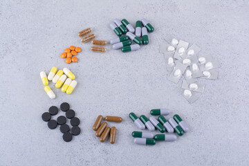 Assortment of medical drugs on marble background