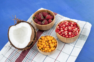 A lot of fresh delicious fruits on tablecloth
