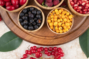 A wooden bowls full of delicious berries