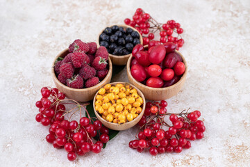 A wooden bowls full of delicious berries