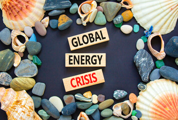 Global energy crisis symbol. Concept words Global energy crisis on wooden blocks. Sea stone,...