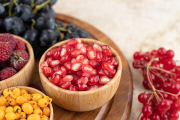 A wooden bowls full of delicious berries