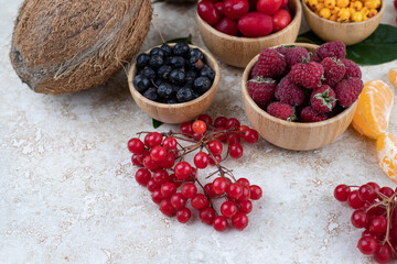 A wooden bowls full of delicious berries