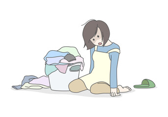 山積みの洗濯物と家事に疲れ果てたお母さん　洗濯物　立てない　ぐったり　へとへと