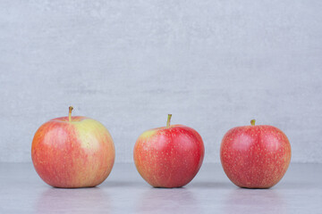 Three whole fresh apple on white background