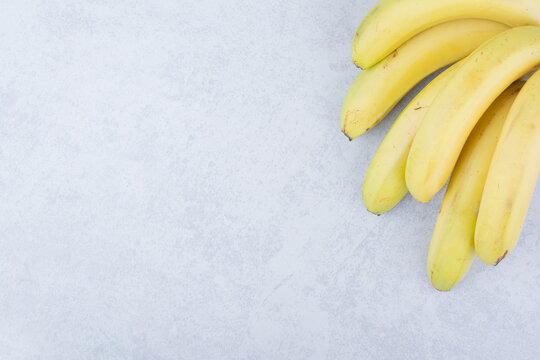 Bunch of ripe fruit bananas on white background