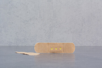 First band aid stickers on marble background