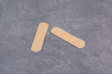 First band aid stickers on marble background