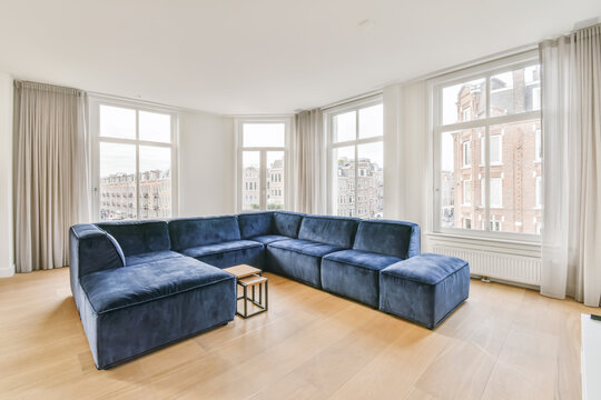 Living room with blue modern sofa