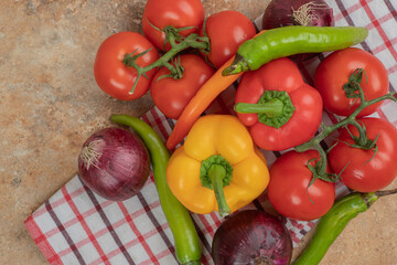 Fresh colorful vegetables on tablecloth background