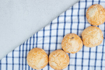 Sweet fresh round cookies on tablecloth