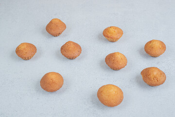 Sweet fresh cupcakes on white background