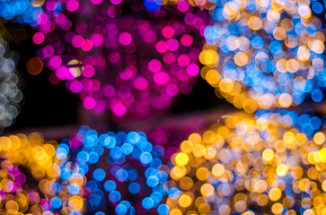 Abstract colorful soft blurred bokeh on black background. Shining and blurred circles lights bokeh background. For used wallpaper texture and background.
