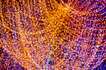 Abstract Long exposure light effect and colorful soft blurred bokeh on black background. Shining and blurred lights bokeh background. For used wallpaper texture and background.