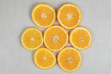 Fresh orange slices on gray background
