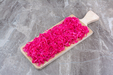 Fermented red cabbage on wooden board