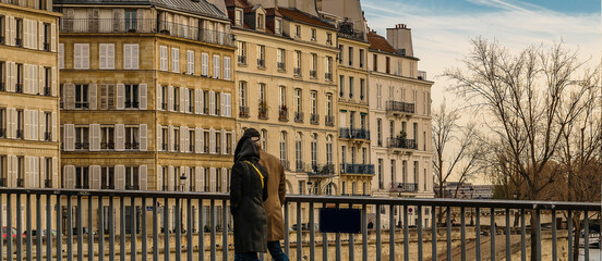 People crossing bridge, paris, france