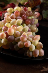 Close up view of ripe grape branch, agricultural harvest concept, viticulture