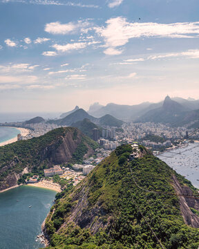 View of Rio de Janeiro cityscape from Sugar Loaf hill, view of Copacabana beach at sunset, Brazil.