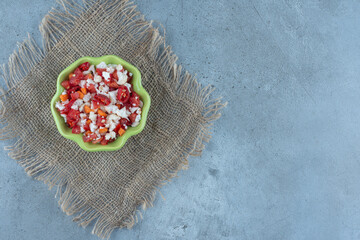 Bowl of cauliflower and pepper salad on marble background