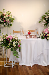 Beautiful wedding decoration. Banquet table setting and decoration. Flower decoration of wedding tables. Cutlery on the table.