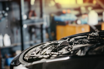 car repair concept, open hood in car service, space for text.