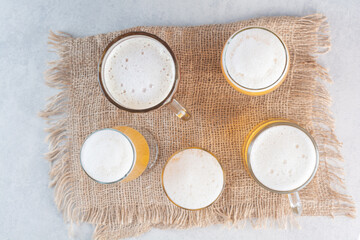 Assortment of beer glasses on sackcloth