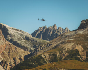 View of an army helicopter in the Dolomites, Italy.